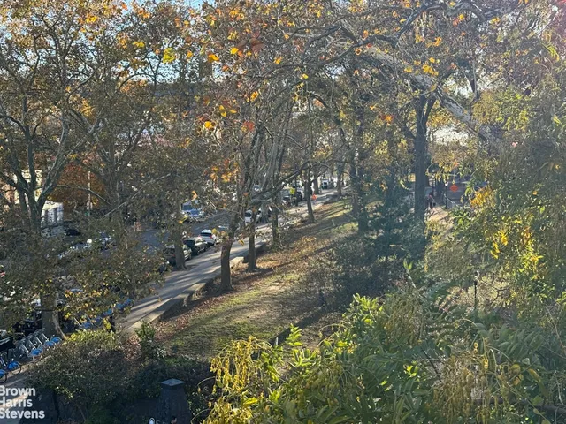 a bathroom with a granite countertop sink and a window