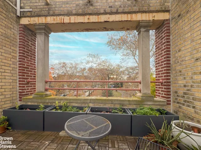 a view of a chairs and table in the balcony