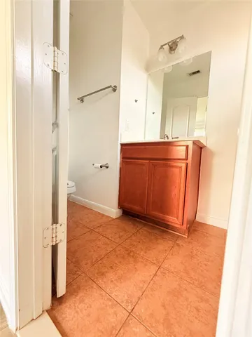 a view of a bathroom with mirror