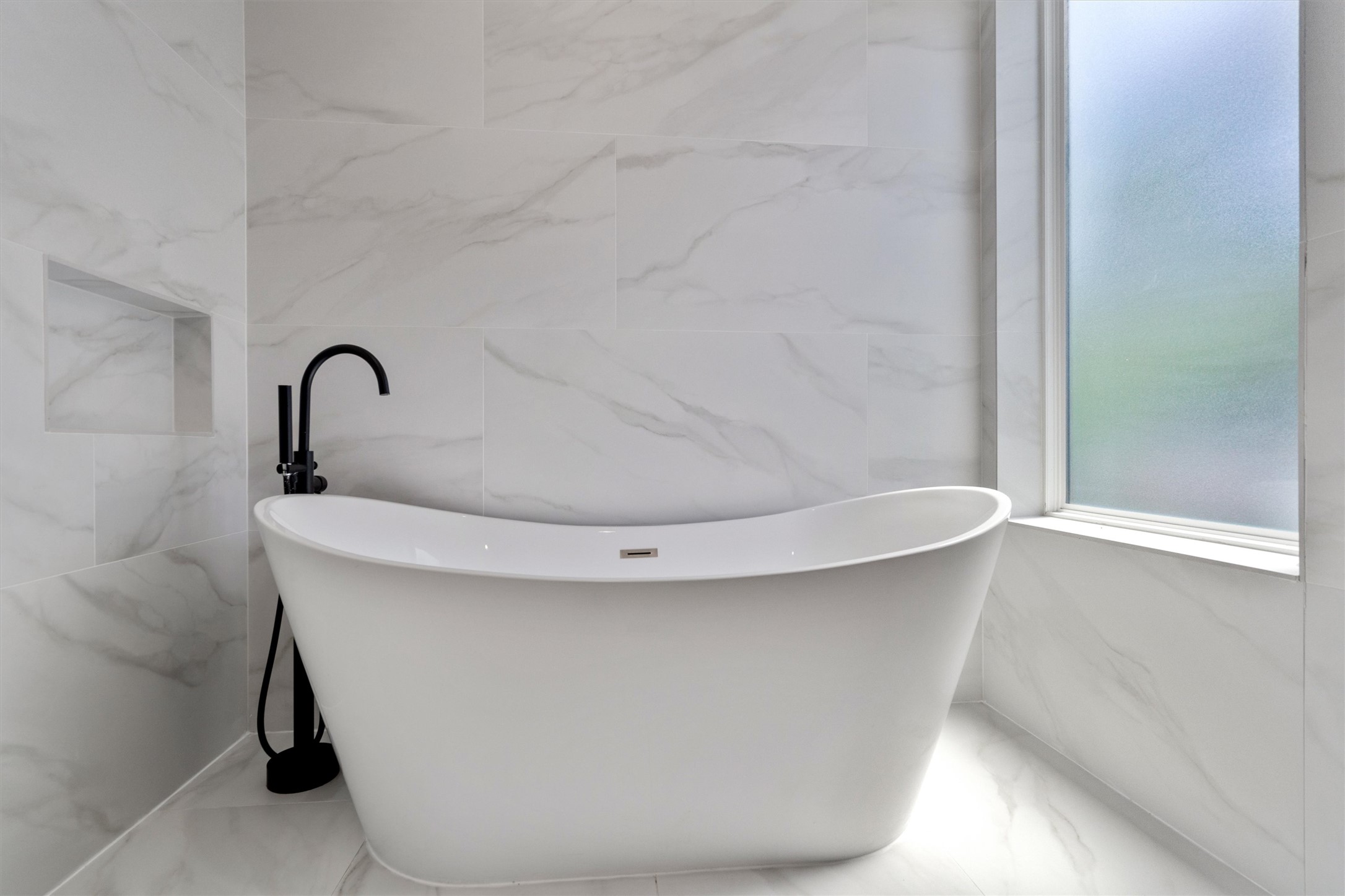 4712 Reyes Street, Unit 1 Austin, TX 78721 - Photo 25 of 38 a picture of a bathtub in a bathroom