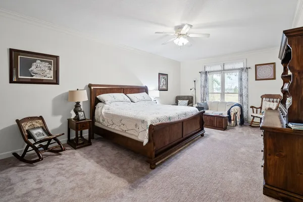 a bedroom with a bed and dresser