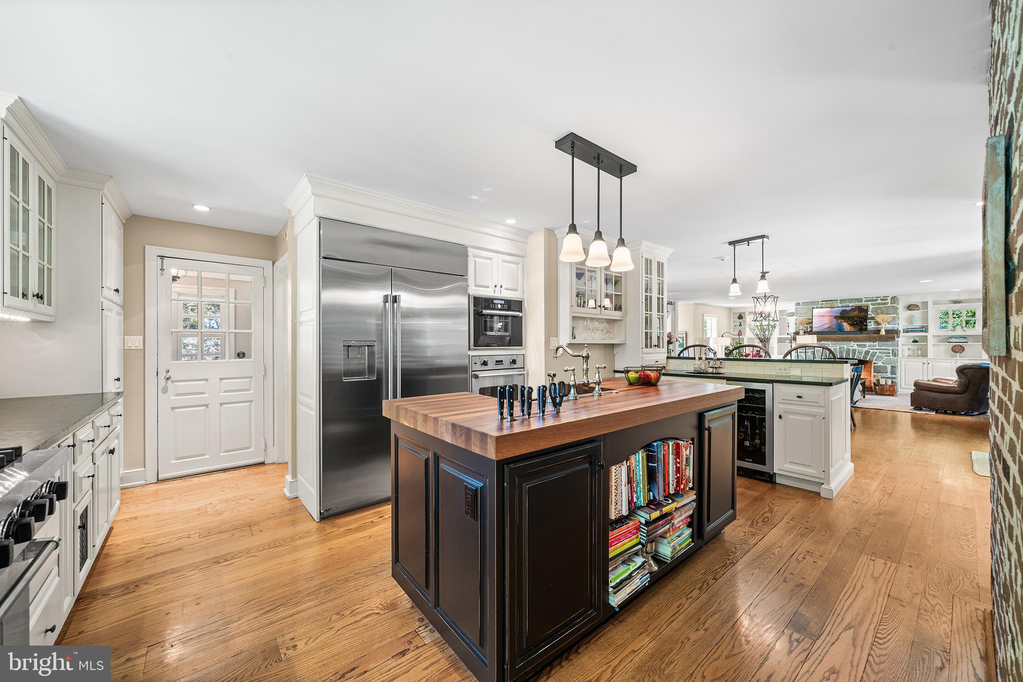 311 Millbank Road Bryn Mawr, PA 19010 - Photo 12 of 54 a kitchen with stainless steel appliances granite countertop a stove and a refrigerator