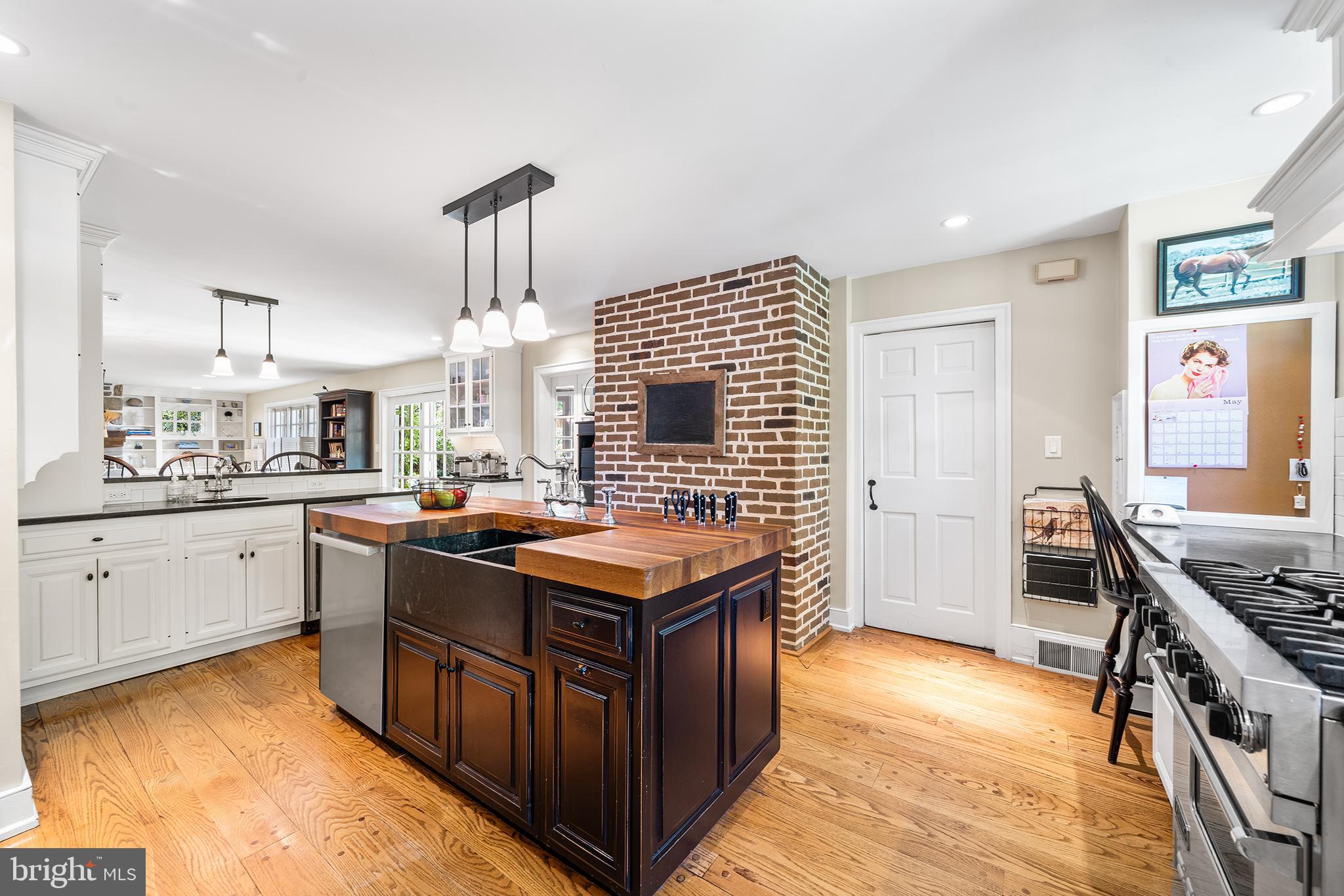 311 Millbank Road Bryn Mawr, PA 19010 - Photo 13 of 54 a kitchen with stainless steel appliances granite countertop a stove a sink dishwasher and a refrigerator