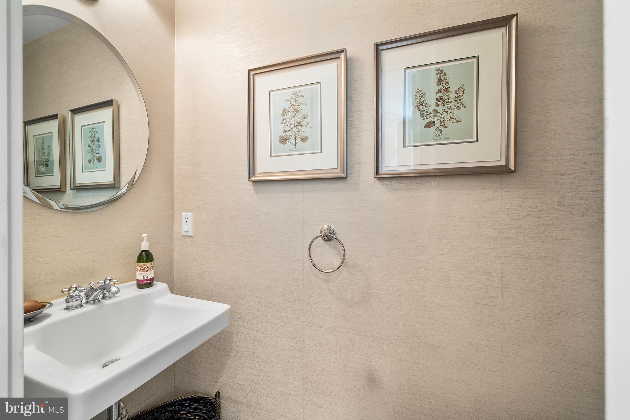 311 Millbank Road Bryn Mawr, PA 19010 - Photo 19 of 54 a bathroom with a toilet sink and mirror