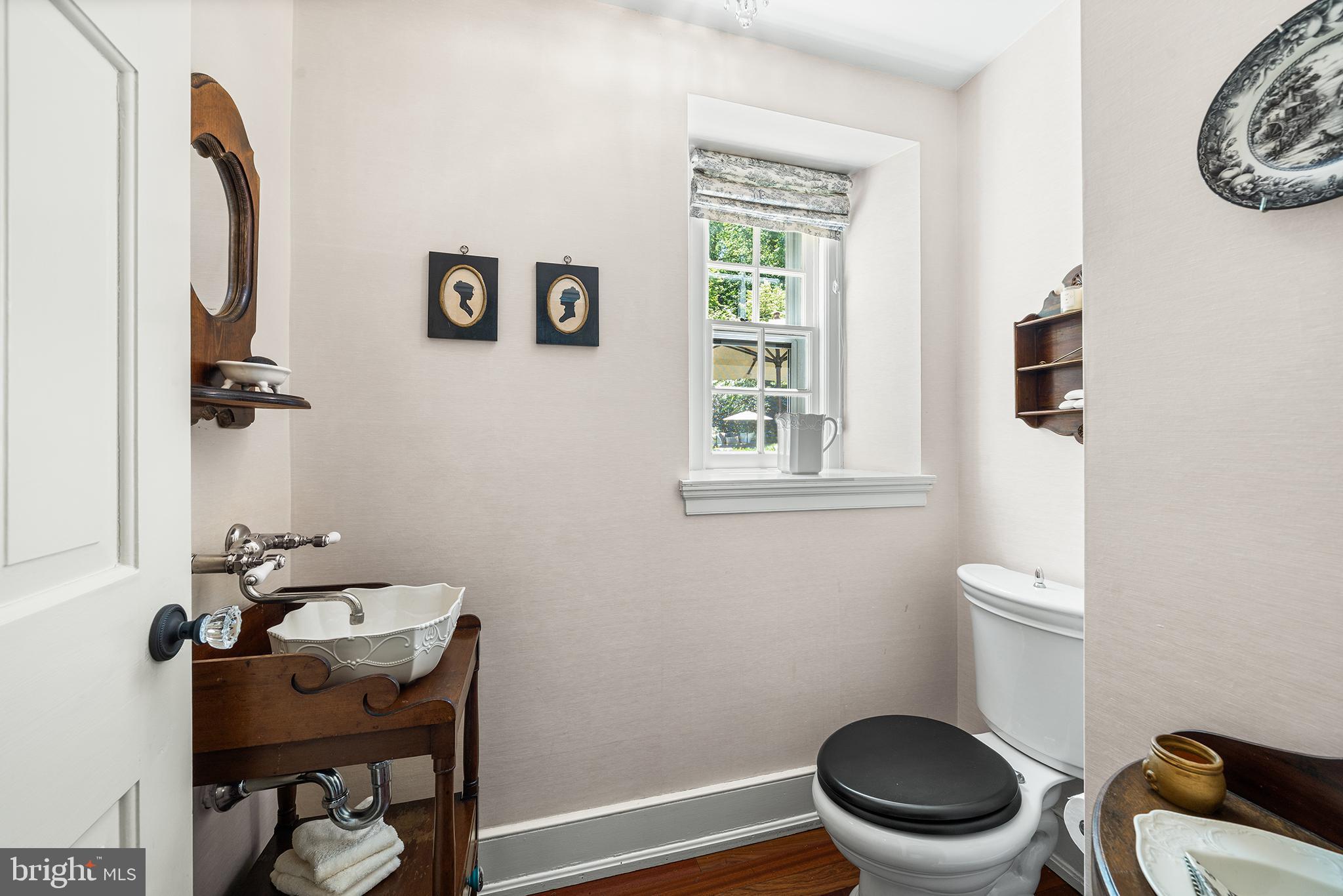 311 Millbank Road Bryn Mawr, PA 19010 - Photo 20 of 54 a bathroom with a toilet a sink and a mirror