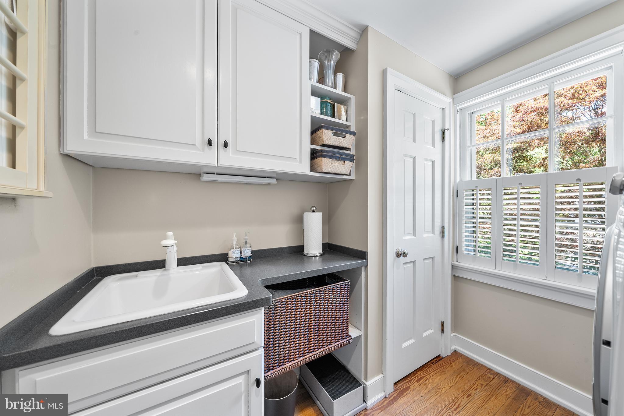 311 Millbank Road Bryn Mawr, PA 19010 - Photo 21 of 54 a kitchen with granite countertop a sink and a window