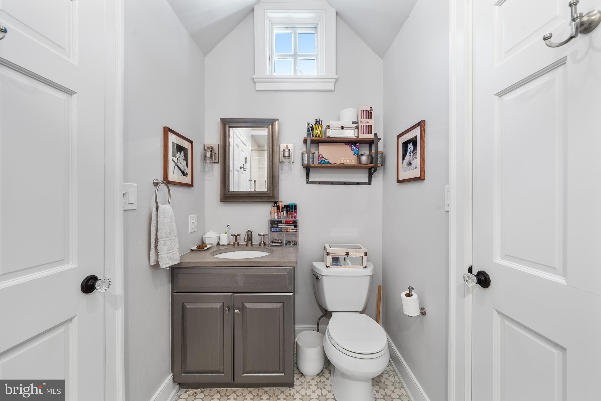 311 Millbank Road Bryn Mawr, PA 19010 - Photo 31 of 54 a bathroom with a toilet sink and mirror