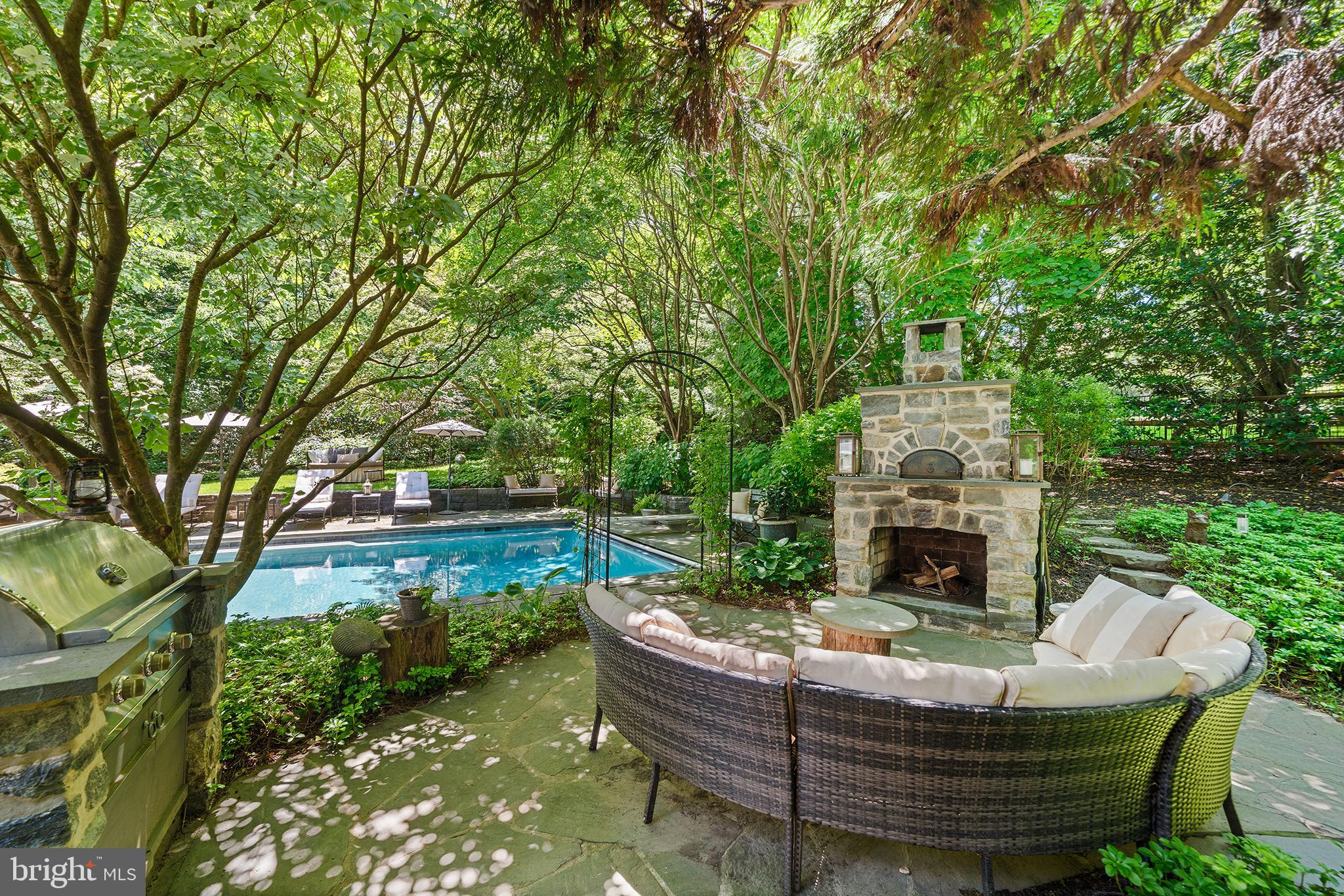 311 Millbank Road Bryn Mawr, PA 19010 - Photo 39 of 54 a view of house with backyard outdoor seating and green space