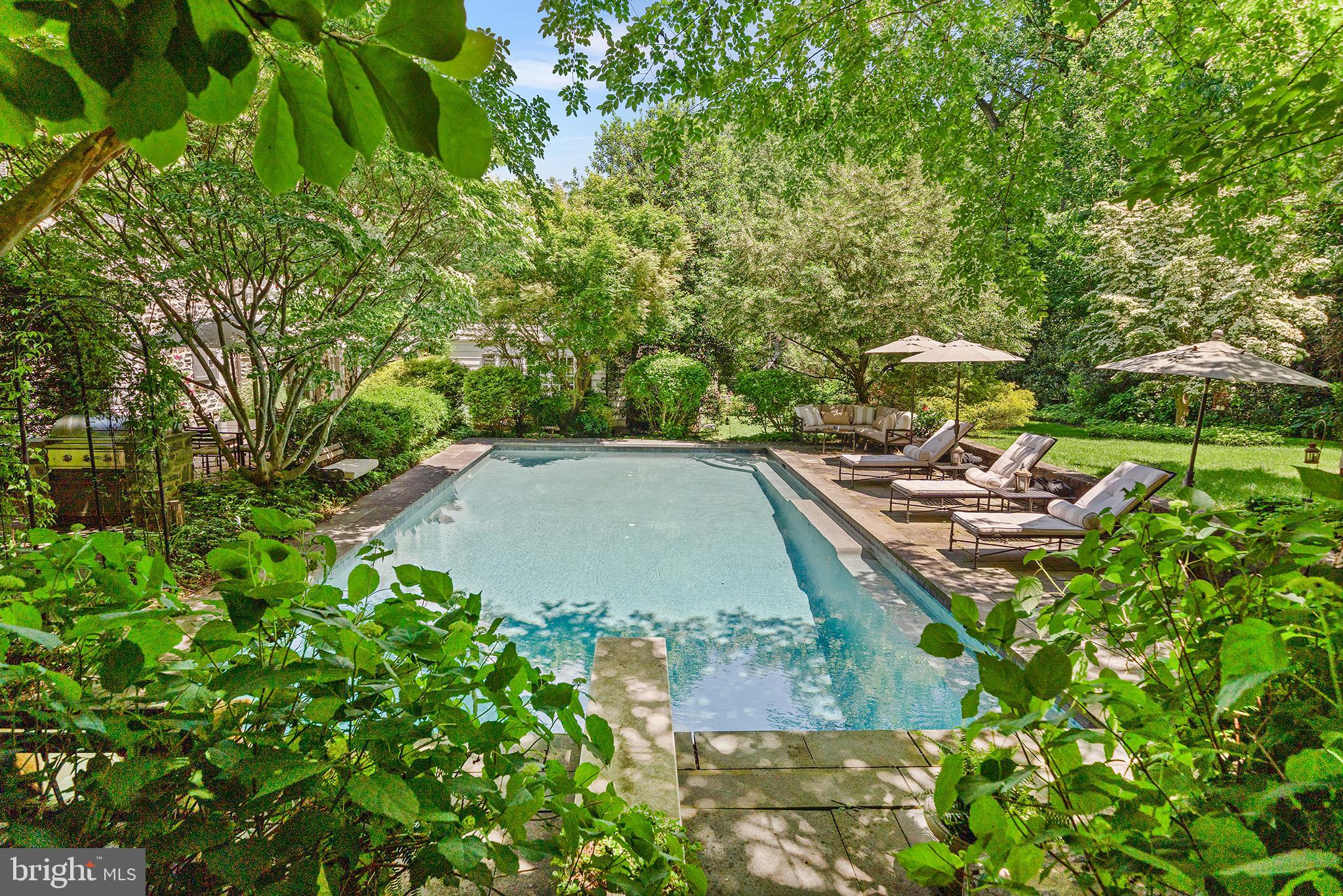 311 Millbank Road Bryn Mawr, PA 19010 - Photo 47 of 54 a view of a backyard with sitting area