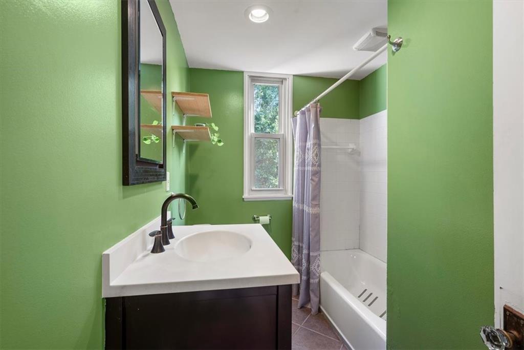 227 Elmore Road Pittsburgh, PA 15221 - Photo 32 of 50 a bathroom with a sink and a mirror
