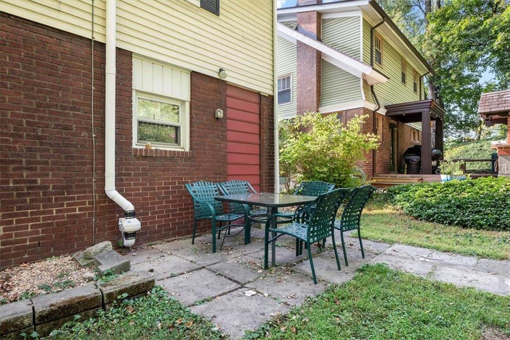 227 Elmore Road Pittsburgh, PA 15221 - Photo 45 of 50 a backyard of a house with outdoor seating