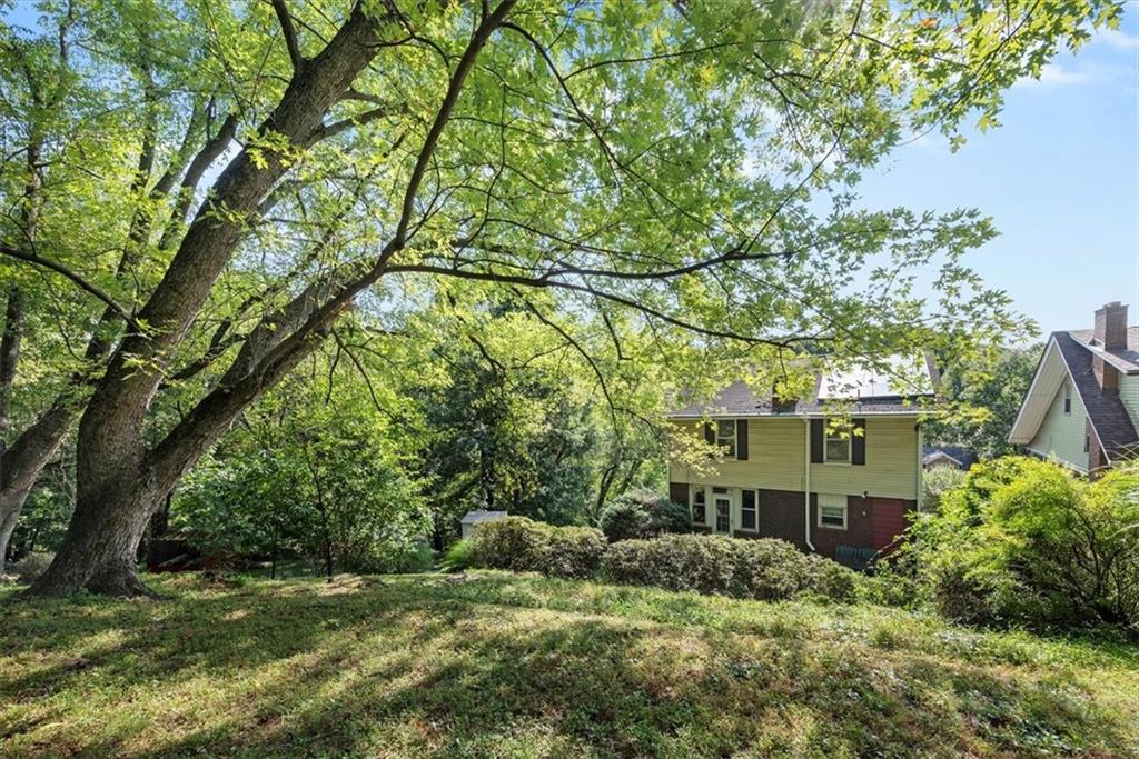227 Elmore Road Pittsburgh, PA 15221 - Photo 47 of 50 a view of a house with a tree