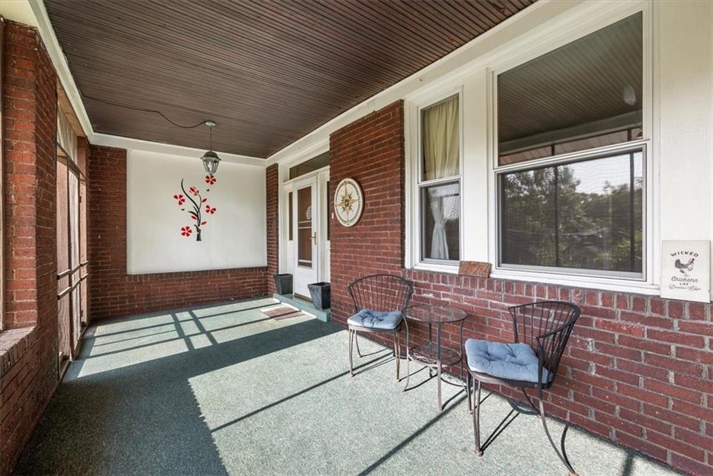 227 Elmore Road Pittsburgh, PA 15221 - Photo 6 of 50 a front view of a house with outdoor seating
