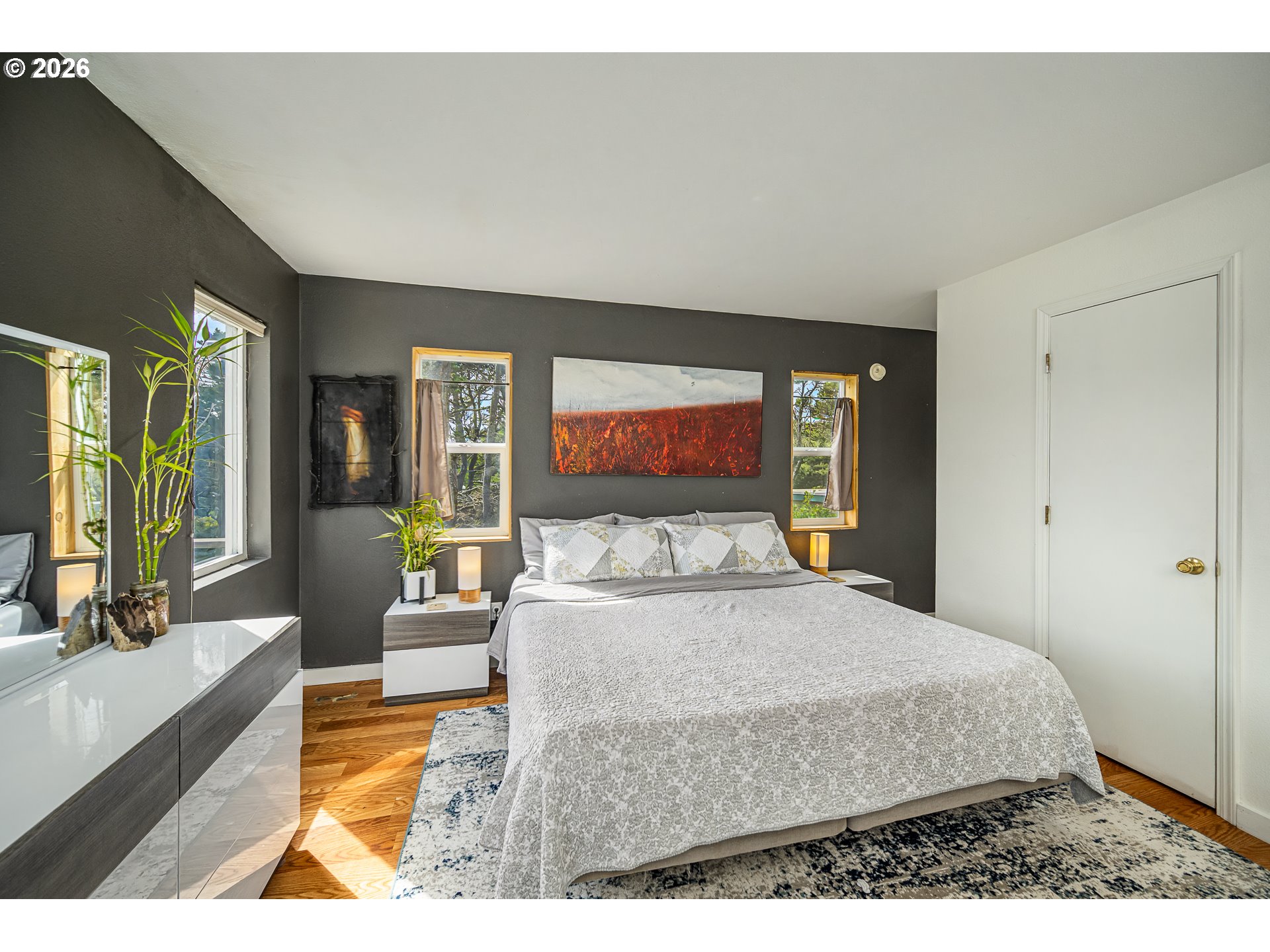 4595 Blanco Street Florence, OR 97439 - Photo 15 of 28 a bedroom with a large bed and a large window