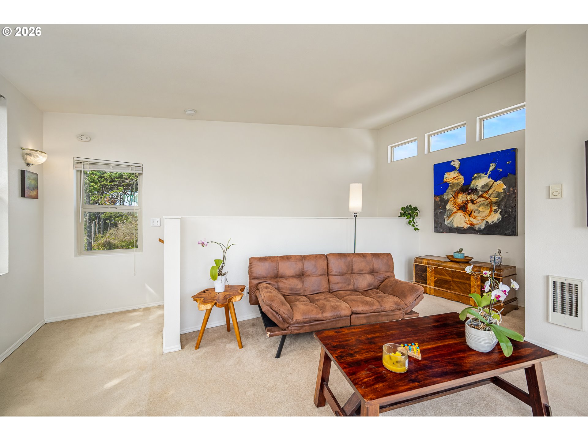 4595 Blanco Street Florence, OR 97439 - Photo 19 of 28 a living room with furniture and wall paintings