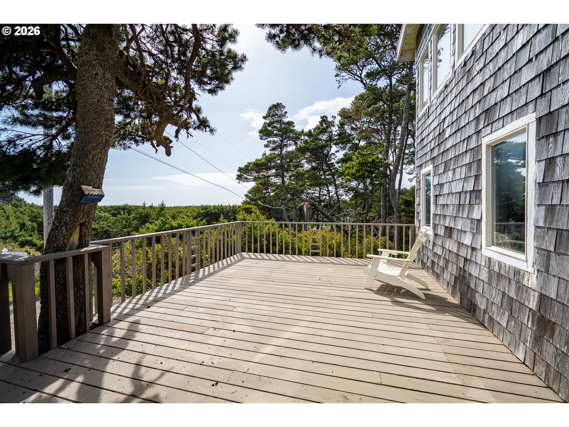 4595 Blanco Street Florence, OR 97439 - Photo 3 of 28 a view of a wooden deck with a patio