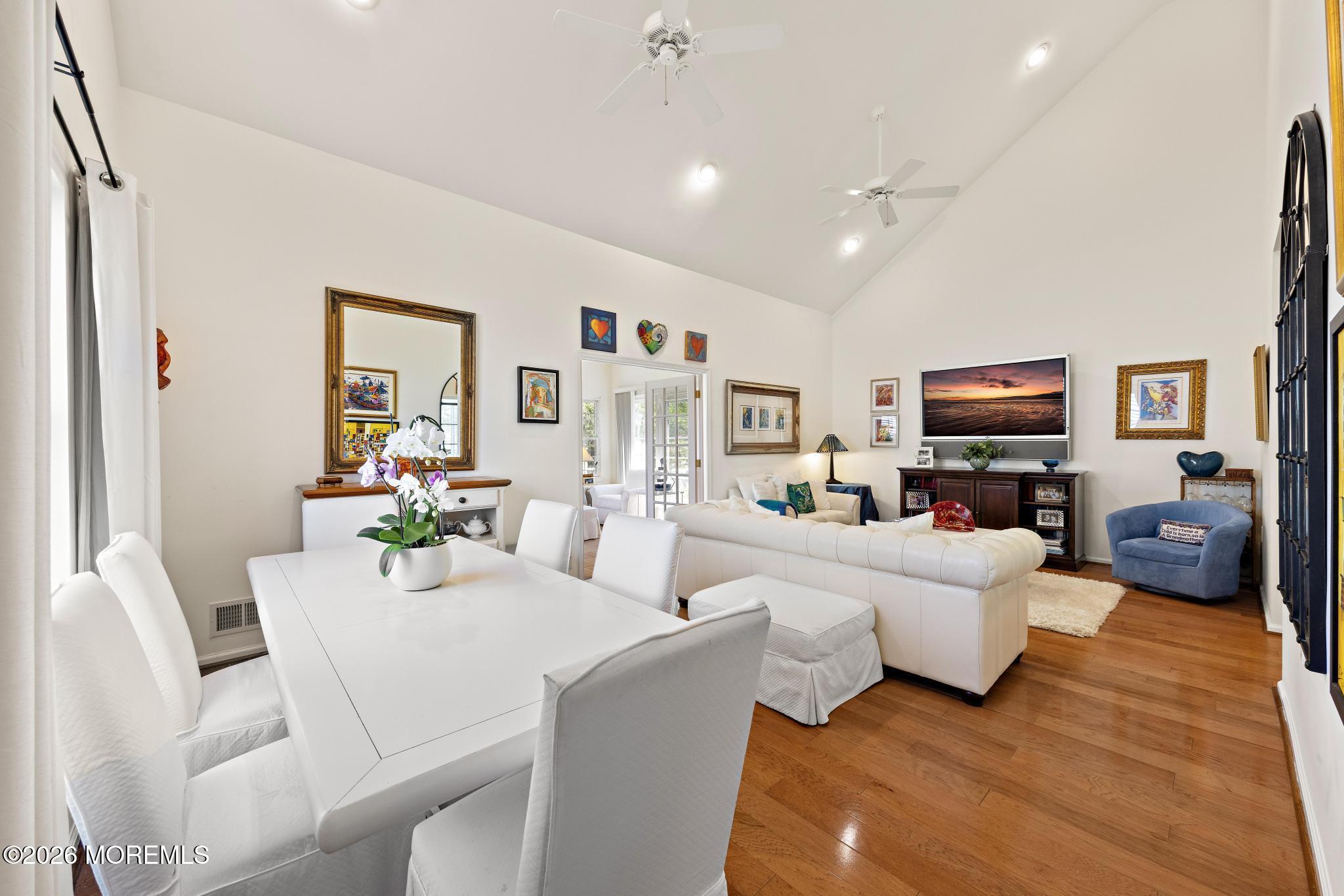 23 Congressional Road Jackson, NJ 08527 - Photo 13 of 65 a living room with furniture a flat screen tv and a fireplace