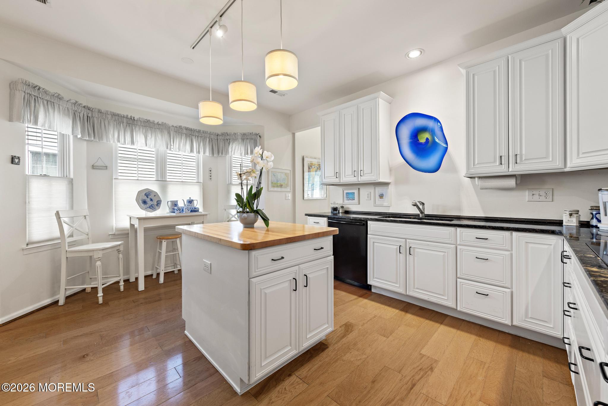 23 Congressional Road Jackson, NJ 08527 - Photo 22 of 65 a kitchen with cabinets and wooden floor