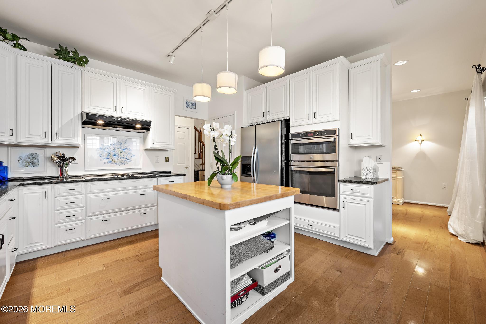 23 Congressional Road Jackson, NJ 08527 - Photo 24 of 65 a kitchen with stainless steel appliances a stove refrigerator sink and cabinets
