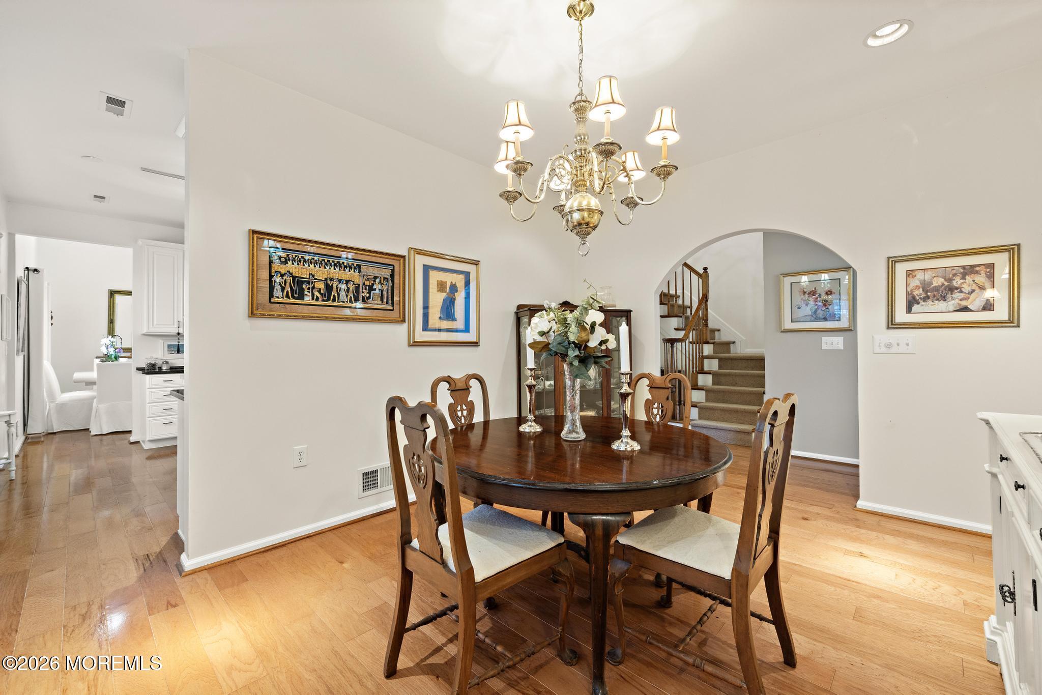 23 Congressional Road Jackson, NJ 08527 - Photo 26 of 65 a view of a dining room with furniture wooden floor and a chandelier