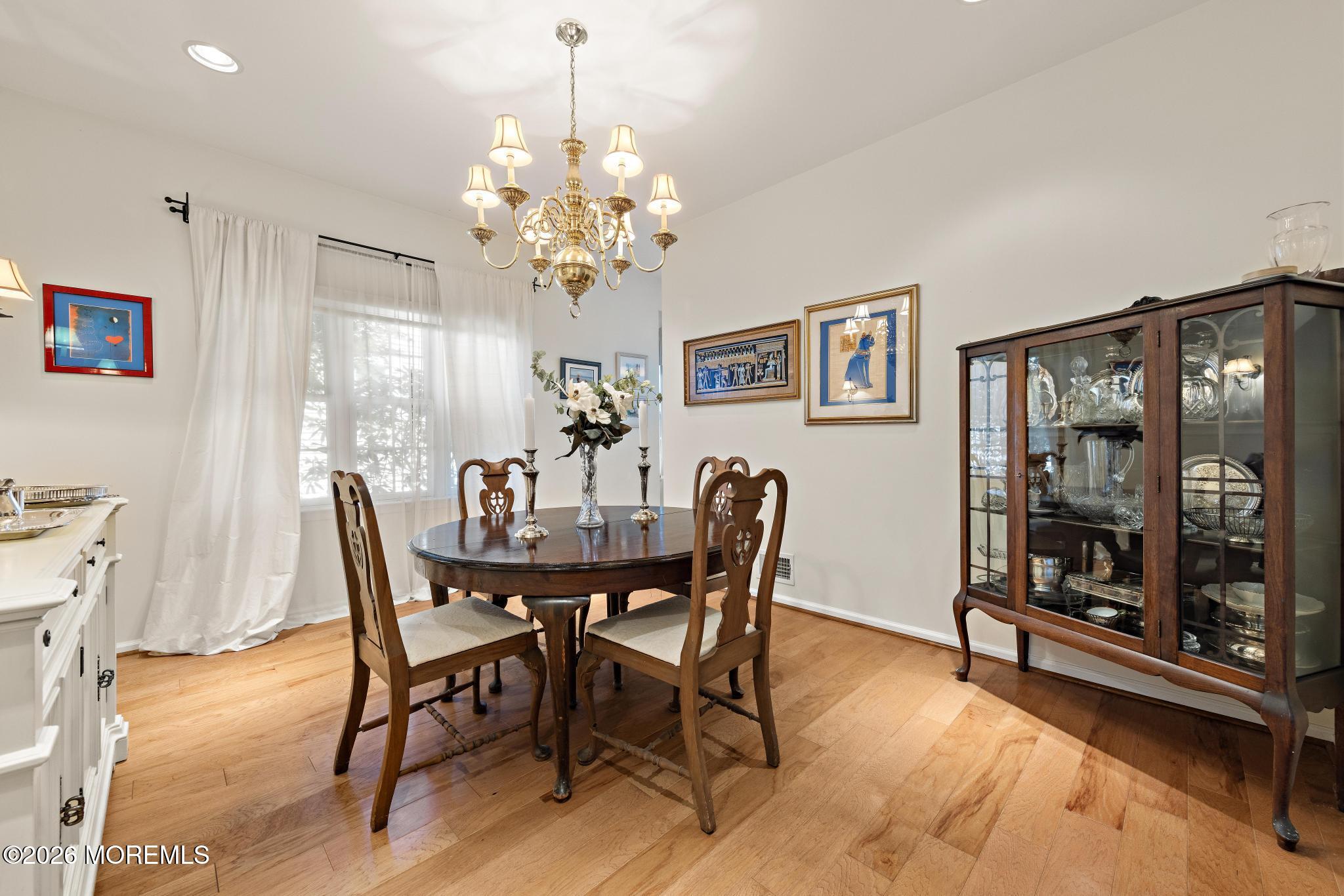23 Congressional Road Jackson, NJ 08527 - Photo 27 of 65 a view of a dining room with furniture and chandelier