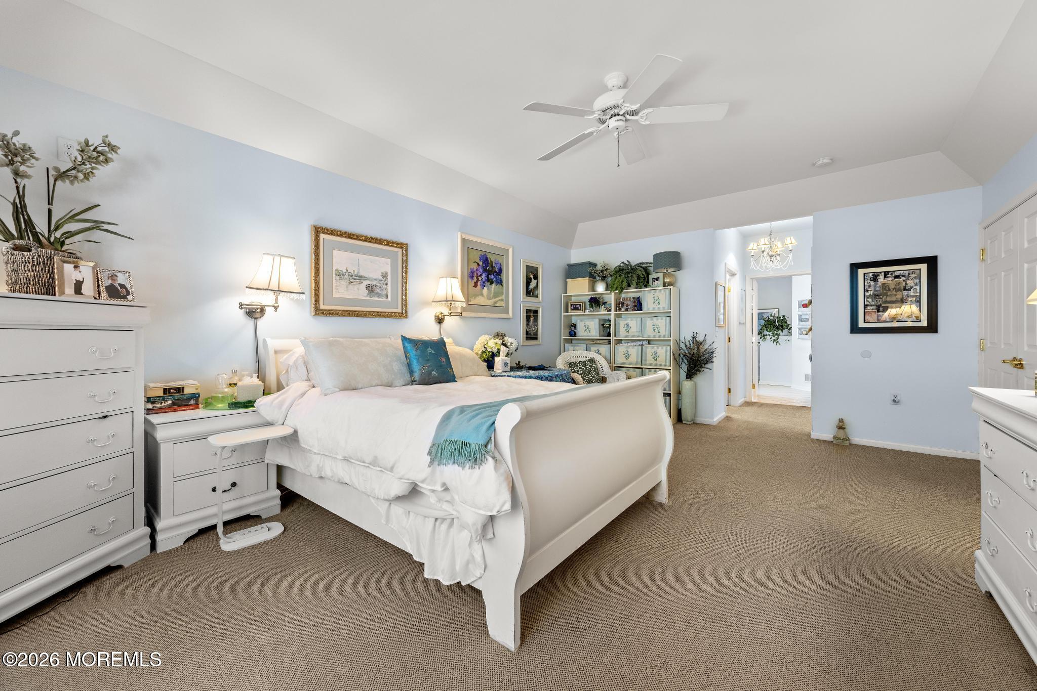 23 Congressional Road Jackson, NJ 08527 - Photo 30 of 65 a bed room with a bed and a chandelier