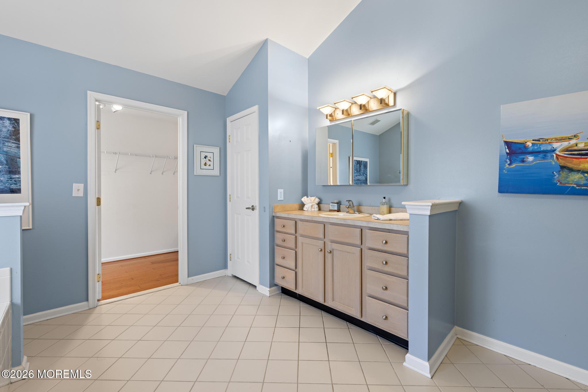 23 Congressional Road Jackson, NJ 08527 - Photo 42 of 65 a spacious bathroom with a double vanity sink and a mirror