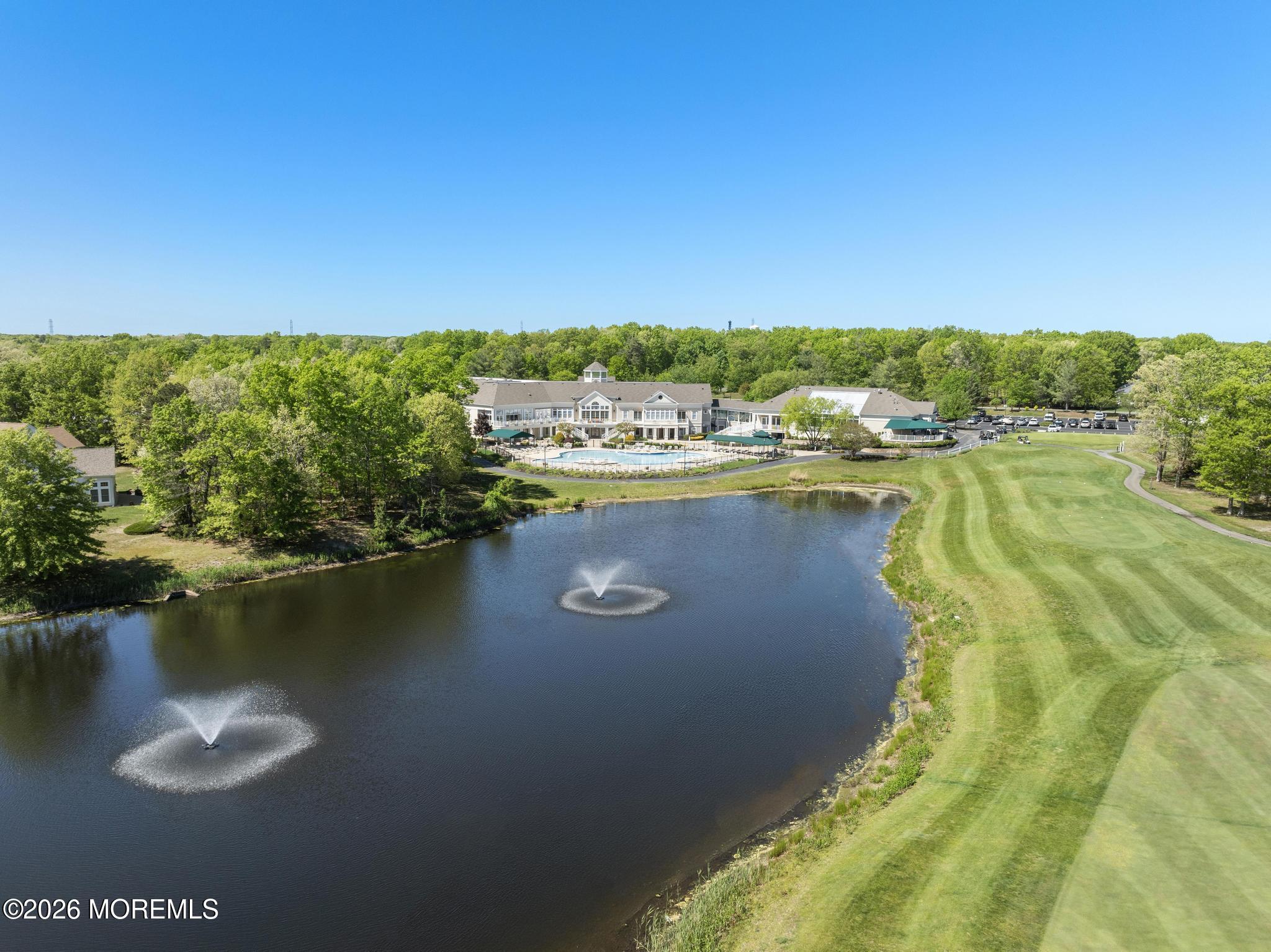 23 Congressional Road Jackson, NJ 08527 - Photo 52 of 65 a view of a lake with a house in the background