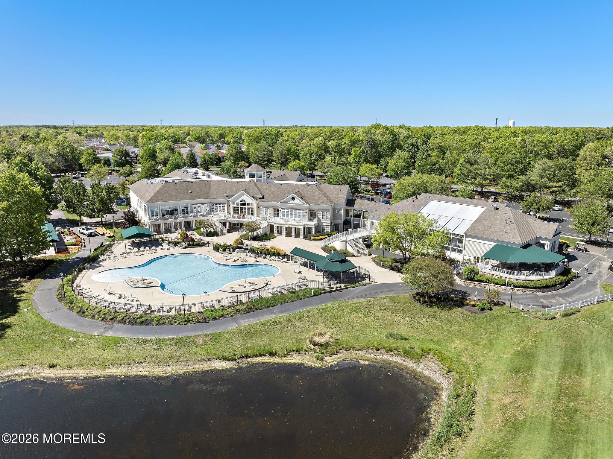 23 Congressional Road Jackson, NJ 08527 - Photo 53 of 65 a view of a swimming pool with a yard