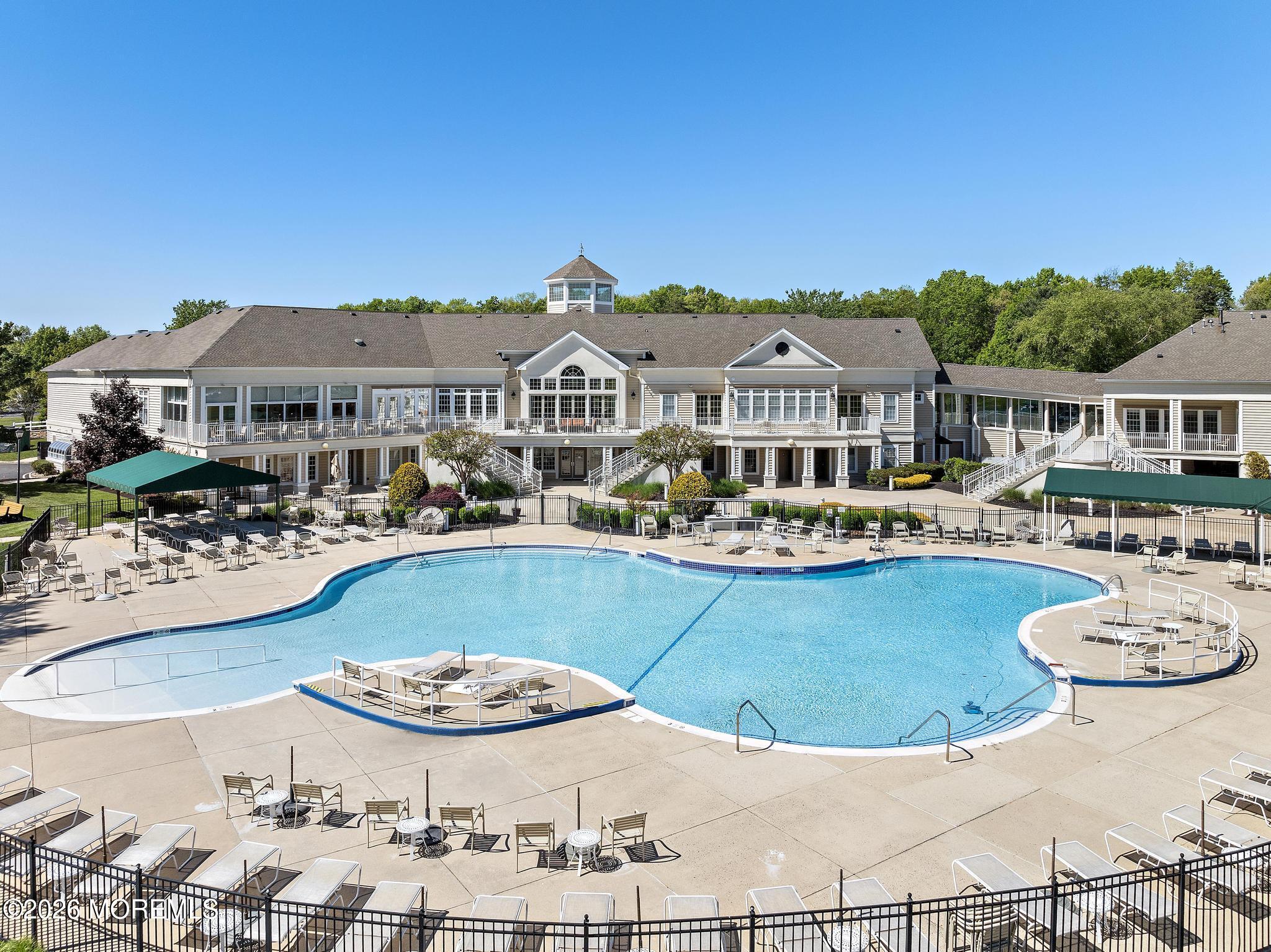 23 Congressional Road Jackson, NJ 08527 - Photo 54 of 65 a view of a house with swimming pool and chairs