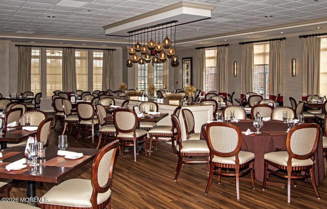 23 Congressional Road Jackson, NJ 08527 - Photo 62 of 65 a room with lots of chairs and a wooden floor