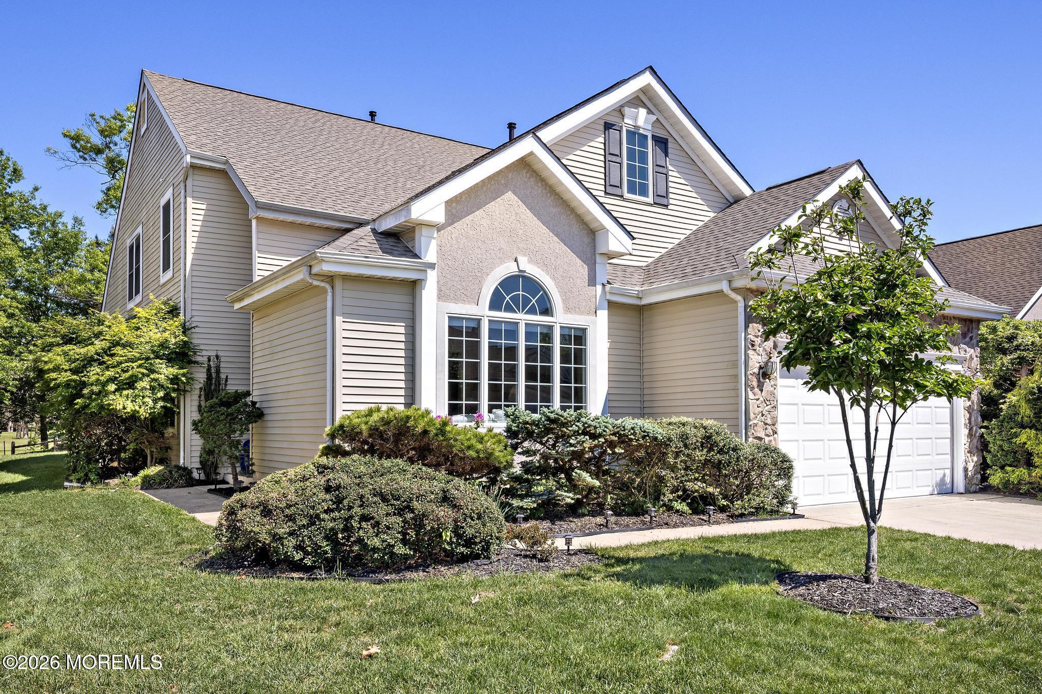 23 Congressional Road Jackson, NJ 08527 - Photo 7 of 65 a front view of a house with a yard and garage