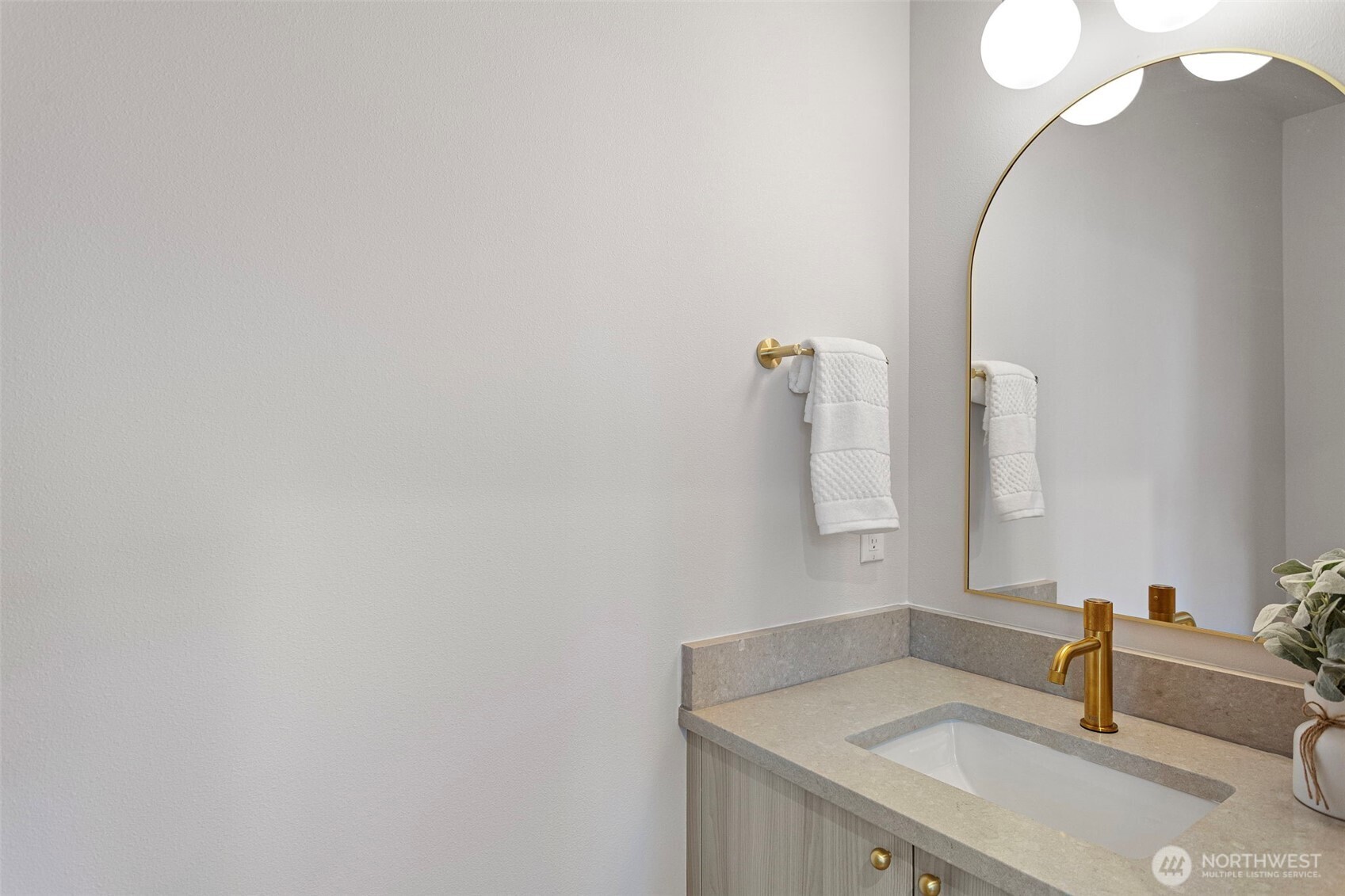 1127 Northwest 58th Street, Unit B Seattle, WA 98107 - Photo 20 of 30 a bathroom with a sink and a mirror