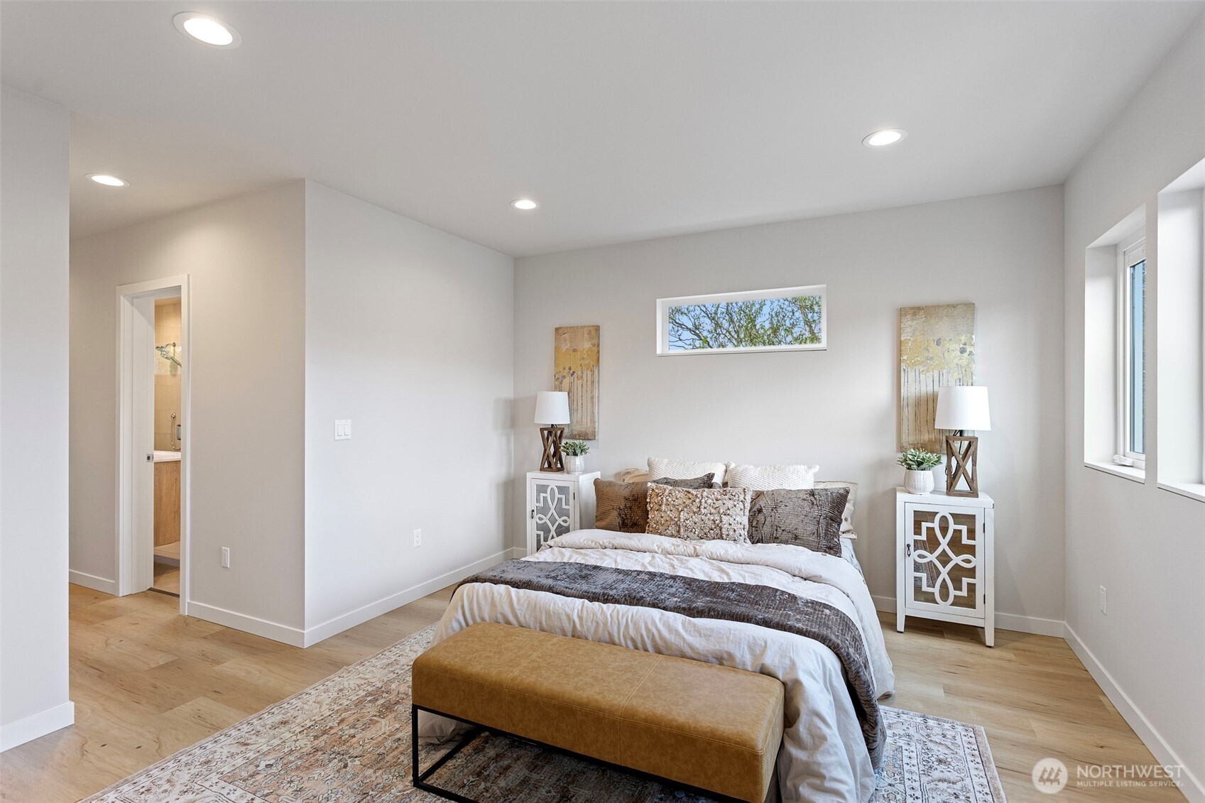 1127 Northwest 58th Street, Unit B Seattle, WA 98107 - Photo 23 of 30 a bedroom with a bed and a couch