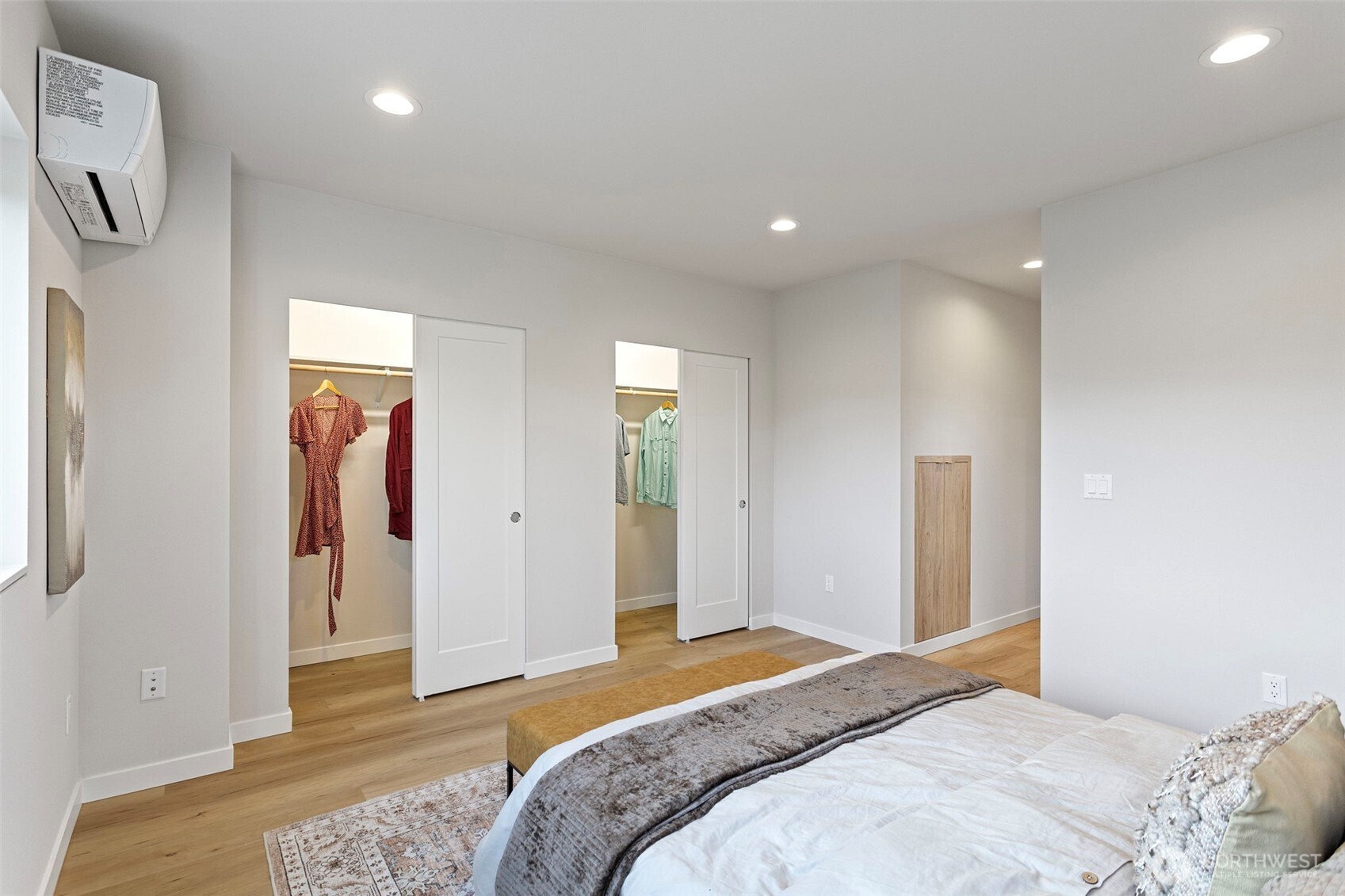 1127 Northwest 58th Street, Unit B Seattle, WA 98107 - Photo 24 of 30 a bedroom with a bed and a walk in closet