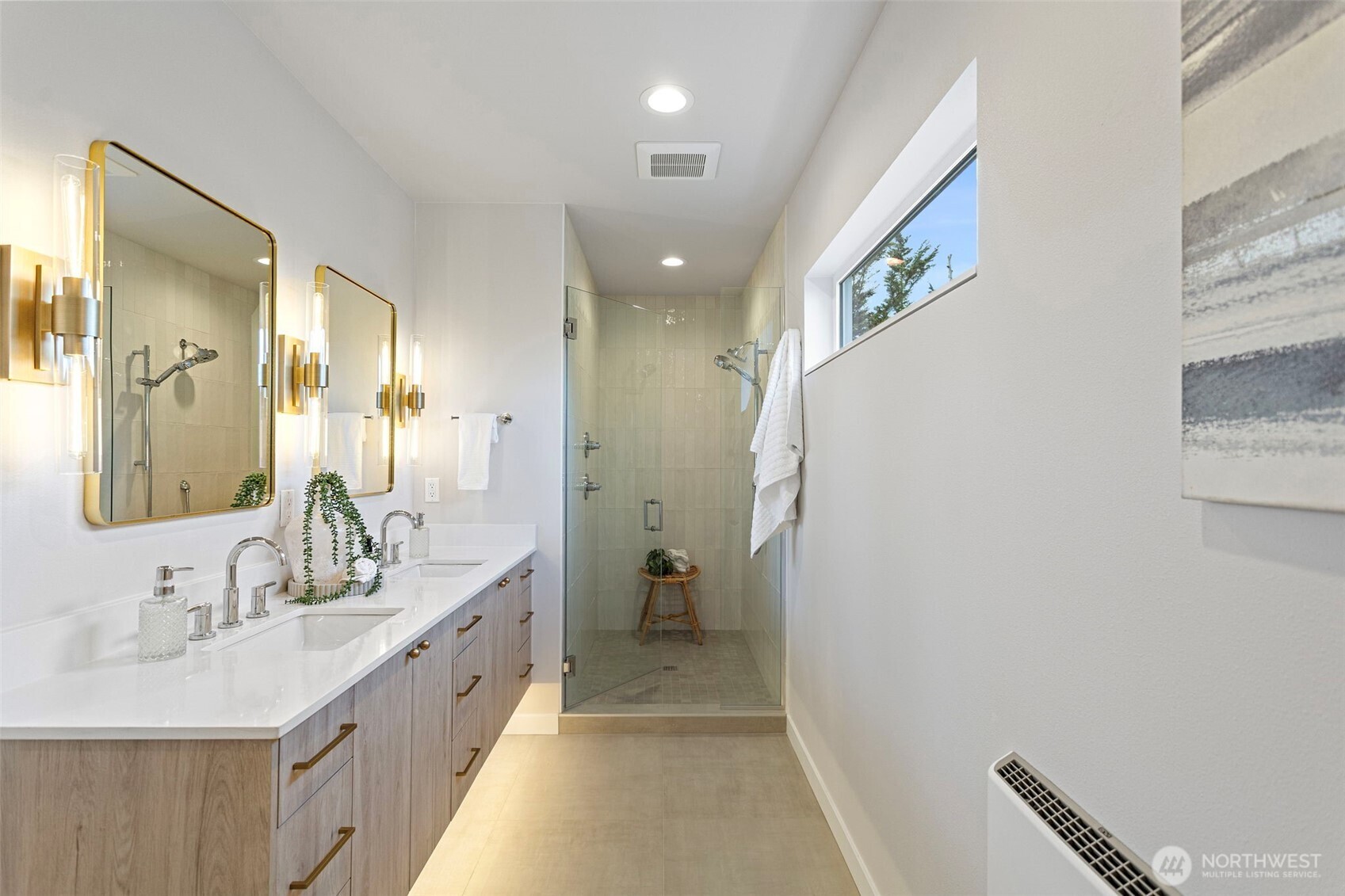 1127 Northwest 58th Street, Unit B Seattle, WA 98107 - Photo 25 of 30 a bathroom with a double vanity sink and mirror