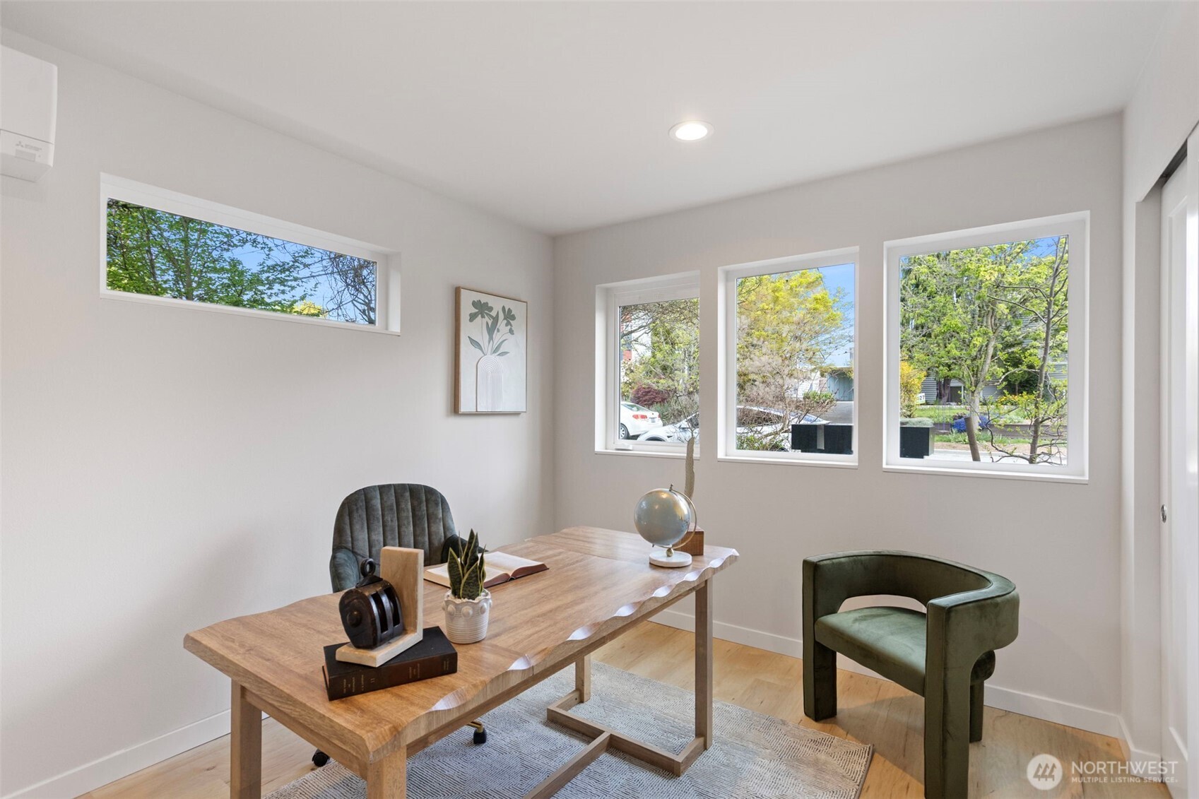1127 Northwest 58th Street, Unit B Seattle, WA 98107 - Photo 5 of 30 a work room with furniture and windows