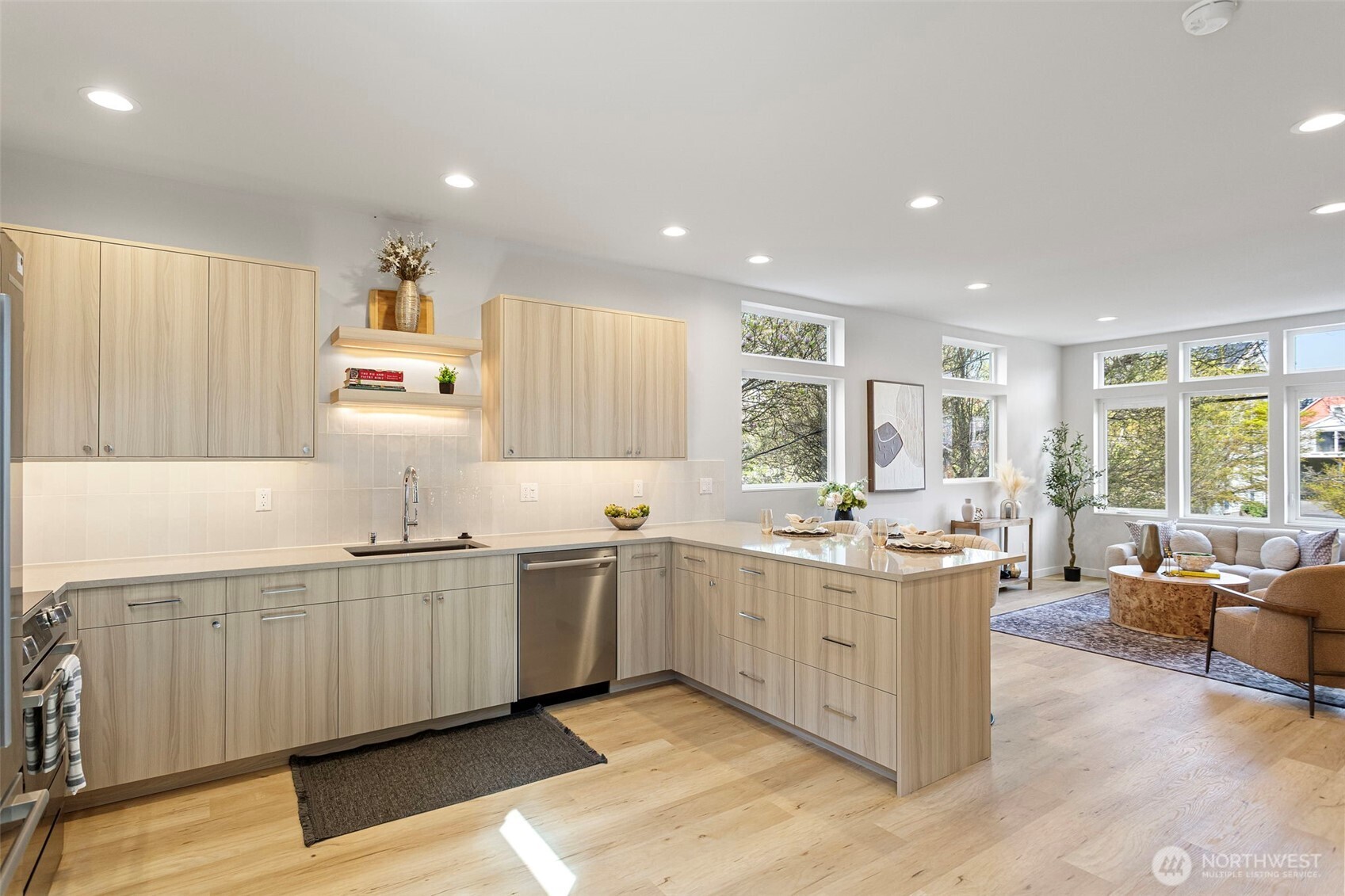 1127 Northwest 58th Street, Unit B Seattle, WA 98107 - Photo 10 of 30 a large kitchen with lots of counter space sink and window