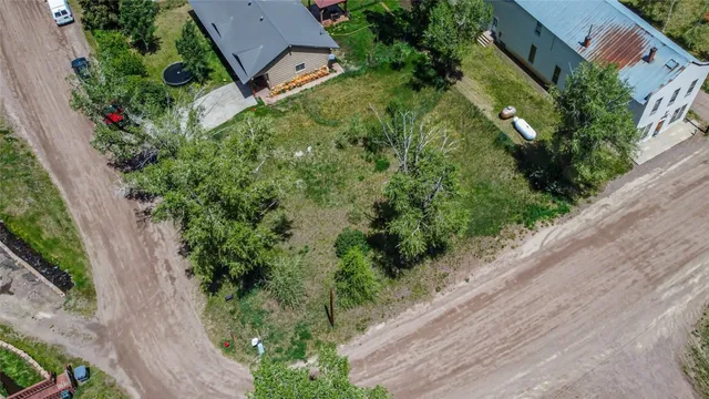 an aerial view of a house with a yard
