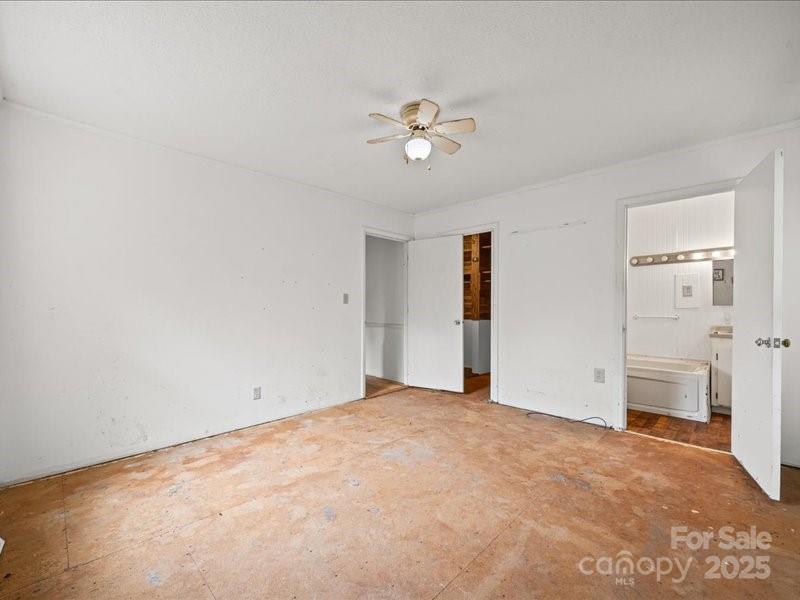 290 South Grandview Road Clover, SC 29710 - Photo 18 of 21 an empty room with closet and a chandelier fan