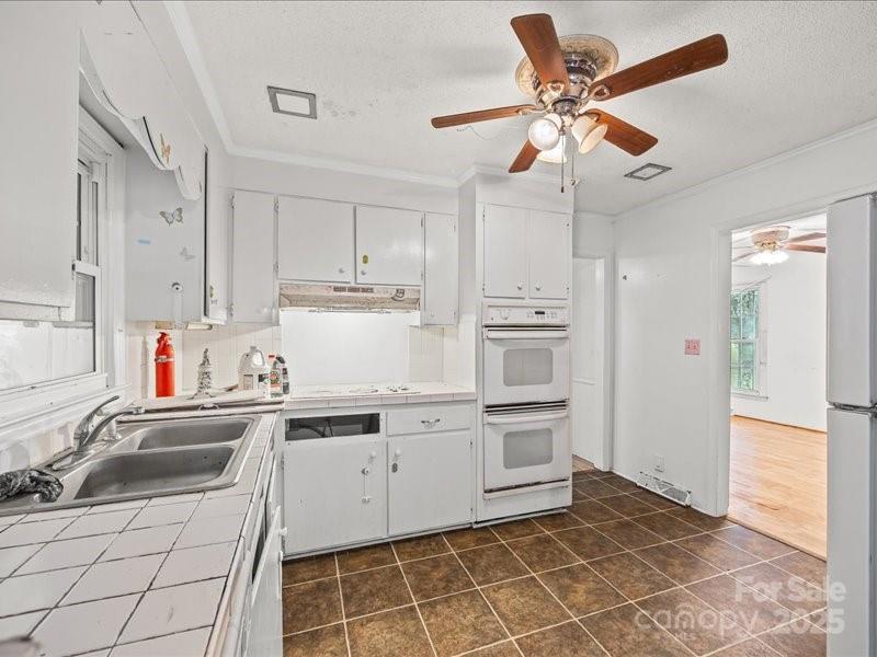 290 South Grandview Road Clover, SC 29710 - Photo 8 of 21 a kitchen with a stove a sink and cabinets