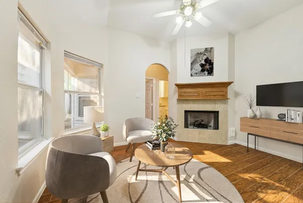 a living room with furniture and a fireplace