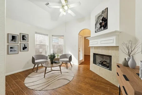 a living room with furniture and a fireplace