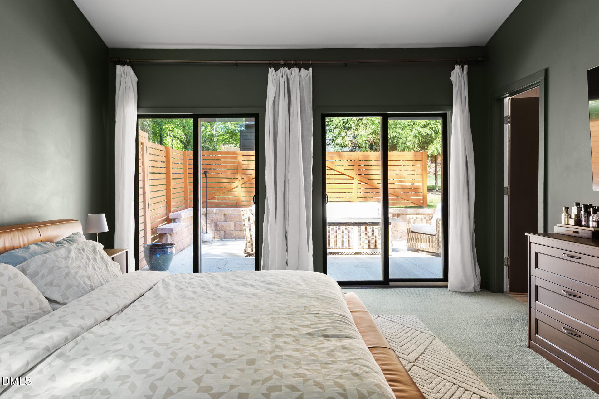 5208 Saddle Court Raleigh, NC 27609 - Photo 25 of 43 a bedroom with a large bed and a large window