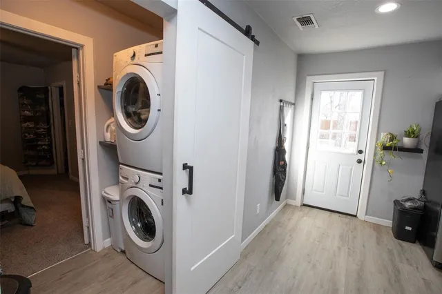 a view of a hallway with washer and dryer