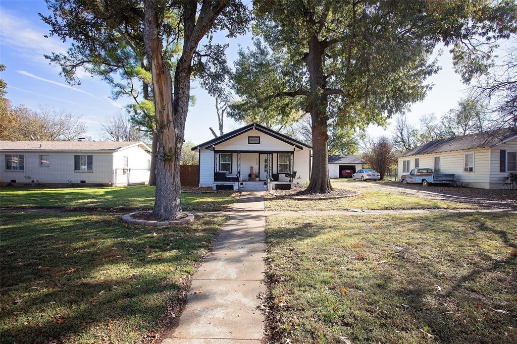 723 Plum Street Graham, TX 76450 - Photo 20 of 20 a house with trees in front of it