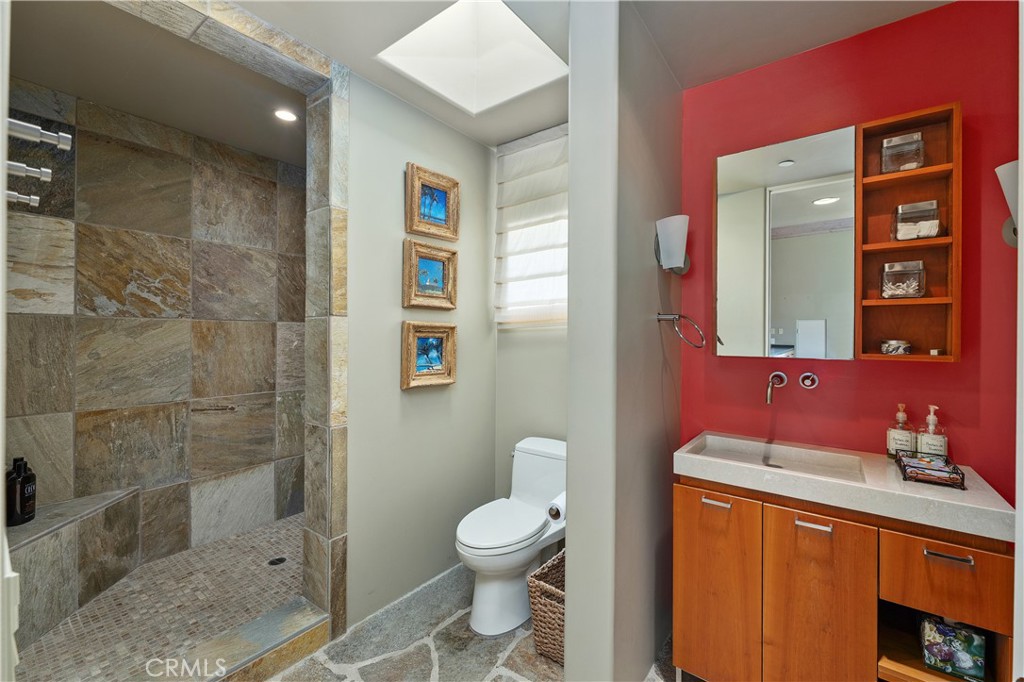 6533 Lago Lindo Rancho Santa Fe, CA 92067 - Photo 50 of 57 a bathroom with a toilet a sink and shower