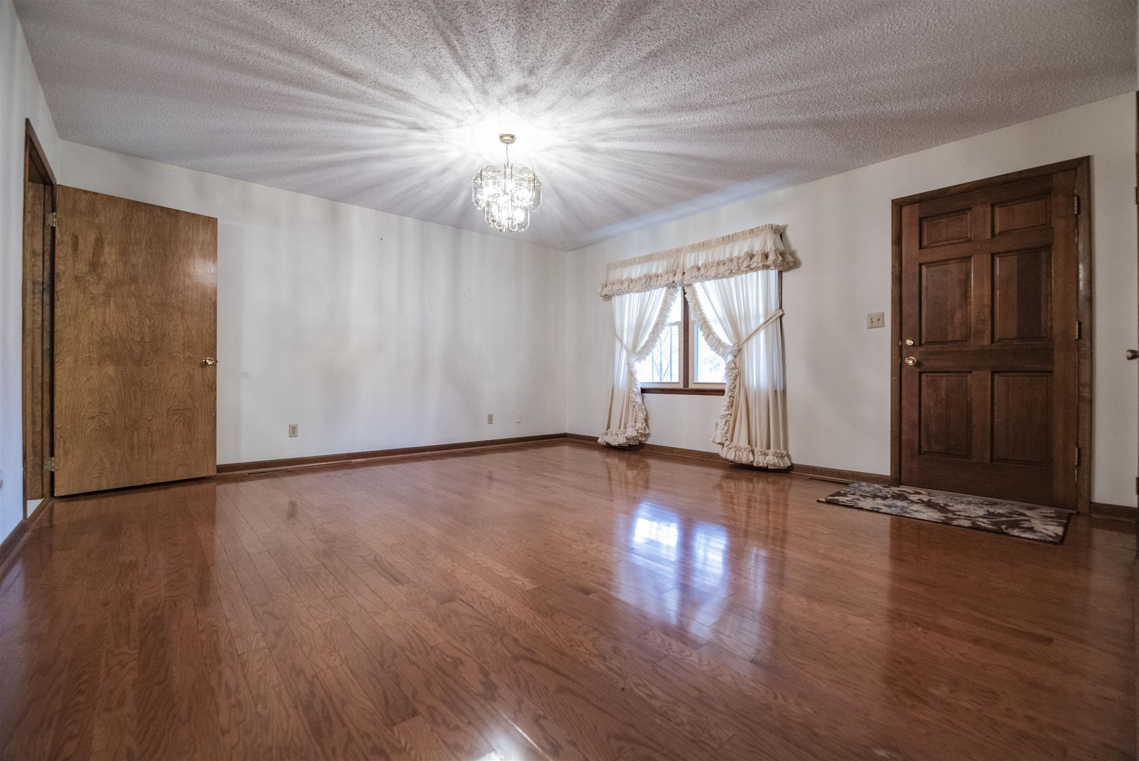 925 Alford Road Murfreesboro, TN 37129 - Photo 2 of 30 an empty room with wooden floor and windows