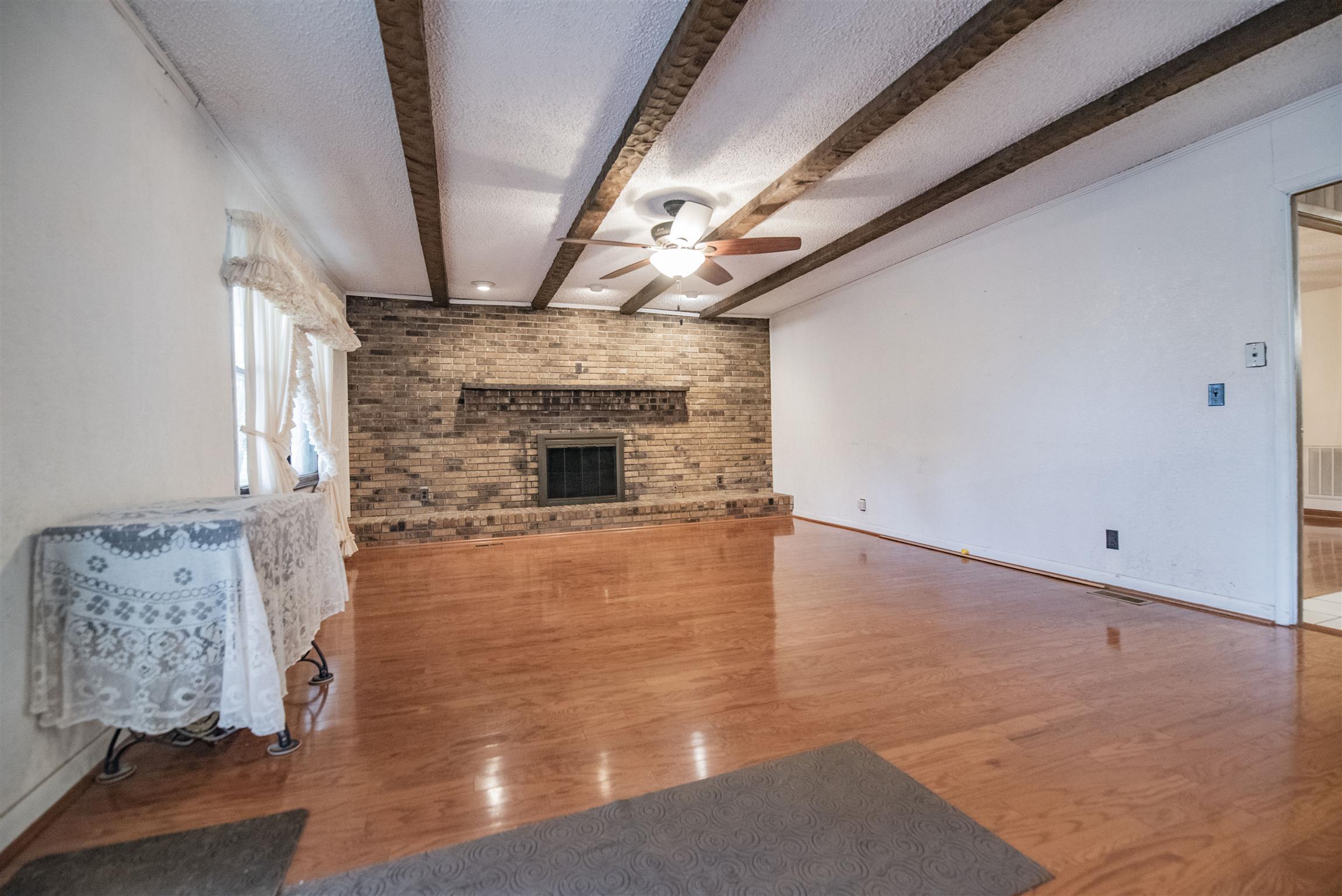 925 Alford Road Murfreesboro, TN 37129 - Photo 6 of 30 a view of empty room with wooden floor and fireplace