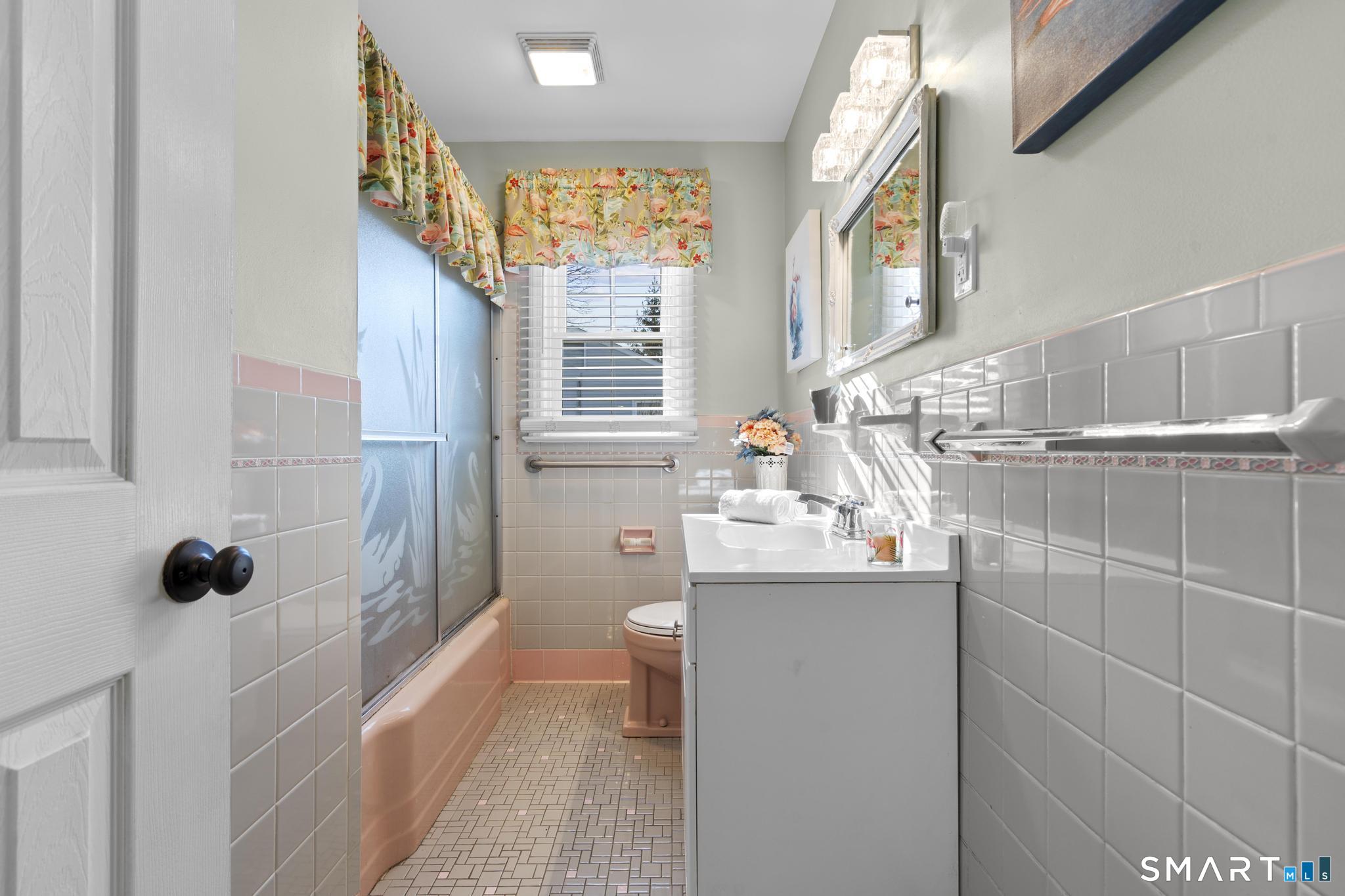 710 East Main Street Stratford, CT 06614 - Photo 18 of 34 a bathroom with a sink a toilet and shower